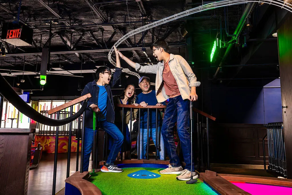 Family celebrating a hole in one